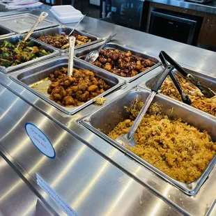 a variety of dishes in a buffet