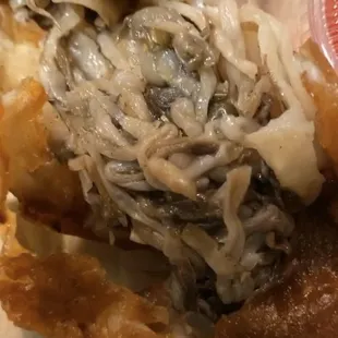 Eggroll (chicken &amp; shrimp) is what the cashier stated, but it looks like trash and smells AWFUL.