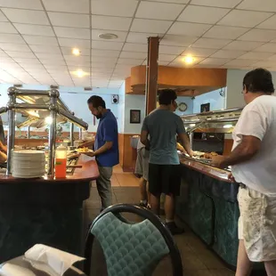 a group of people preparing food