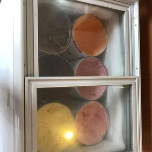 a display case with a variety of donuts