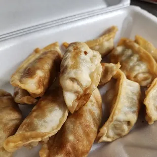 a close up of a plate of dumplings