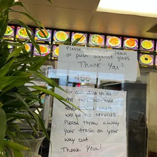 a sign in a restaurant window