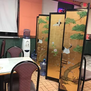 a room with a table and chairs