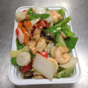 a salad in a styrofoam container