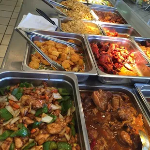 a variety of food in a buffet