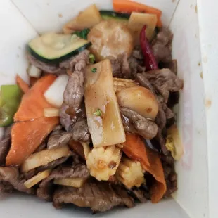 beef and vegetables in a white container