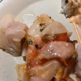 a plate of sushi and shrimp