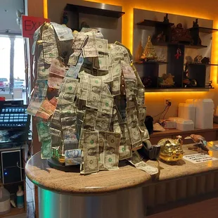 a counter with a lot of money on it
