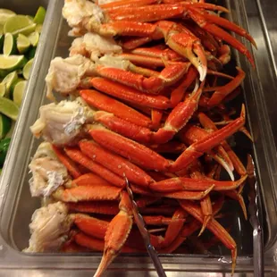 a display of crab legs and vegetables