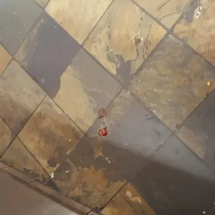 a dirty kitchen floor