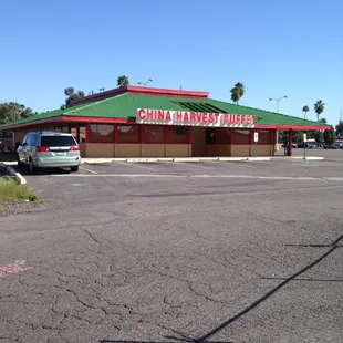 a car parked in front of a chinese restaurant