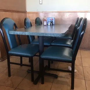 Outdated restaurant. Dirty floors, chairs and tables.