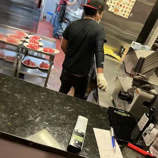 a man preparing food in a kitchen