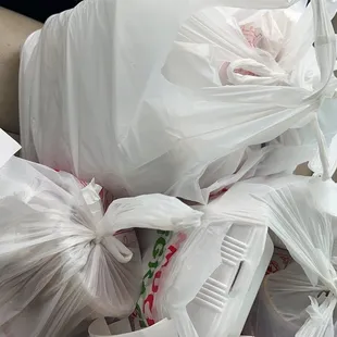 a bunch of bags in the back of a car