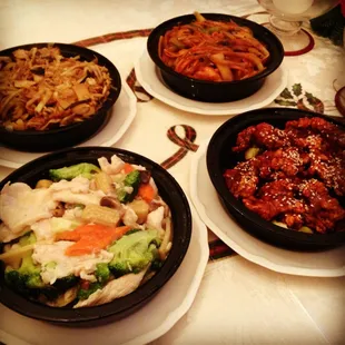 Clockwise from upper right corner: shrimp with garlic, sesame beef, moo goo gai pan, and mu shu pork.