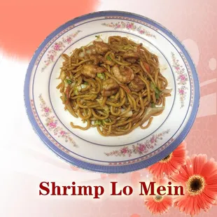 a plate of noodles with shrimp and vegetables