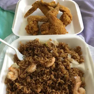 two dishes of fried chicken and rice