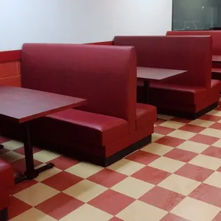red booths and checkered floor