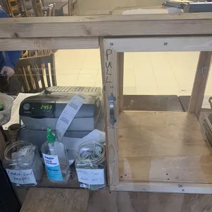 the inside of a kitchen with a work bench