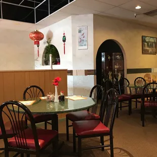 a dining room with tables and chairs