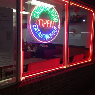 a neon sign in a window