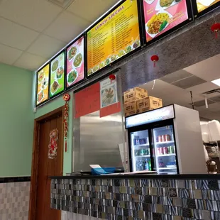 menus on the wall of the restaurant