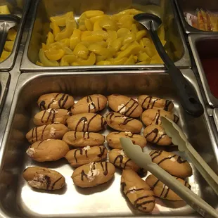 a variety of food items in a buffet