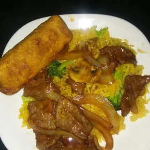 Vegetable rice steak and onions and shrimp egg roll.