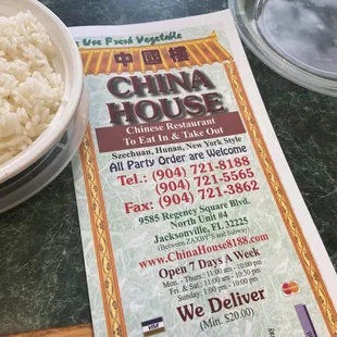 a bowl of rice and a menu