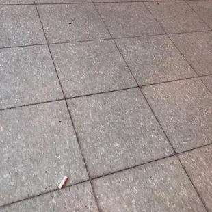 Cigarettes butts in the lobby.