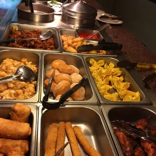 a variety of food items in a buffet