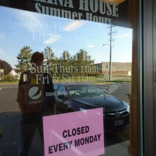 Hours of operation, front entry door.