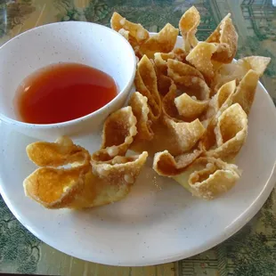 Fried wontons with dipping sauce.