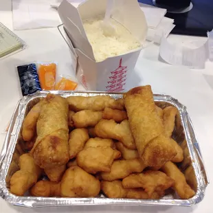 Uninspired sweet and sour chicken and leafy egg rolls