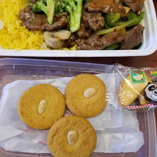 Hunan style beef with fried rice. I know I never seen yellow fried rice before either. Just add soy sauce and it's good!