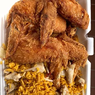 fried chicken and rice in a styrofoam container