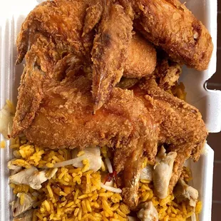 fried chicken and rice in a styrofoam container