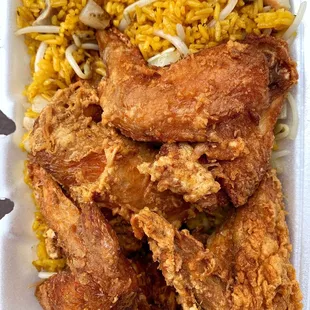 fried chicken and rice in a styrofoam container