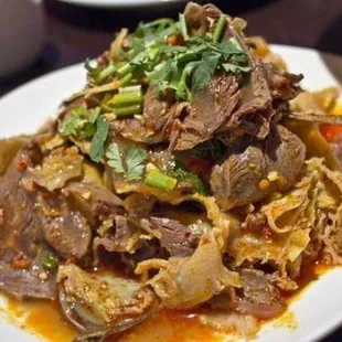 a plate of beef and cabbage