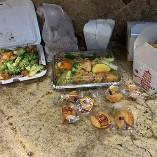 $56: 2 chicken low meins, 6 egg rolls, shrimp+broccoli (lunch special with rice &amp; a drink), and triple delight with side of white rice.