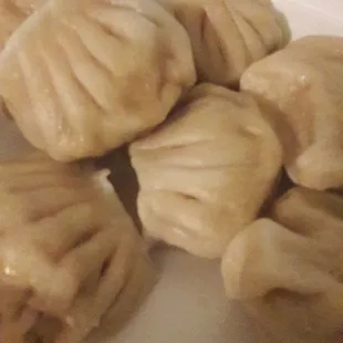 a plate of steamed dumplings