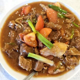a bowl of stew with meat and vegetables