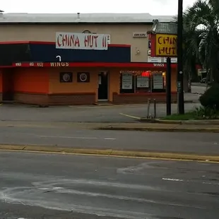 a car parked in front of a chinese restaurant
