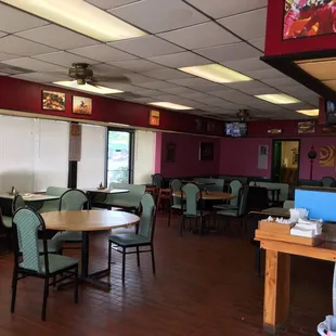 a dining area with tables and chairs