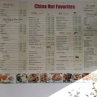 a menu on the wall of a restaurant