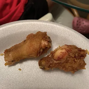 The world's smallest chicken wings. 5 for $5.95. With a funny taste.