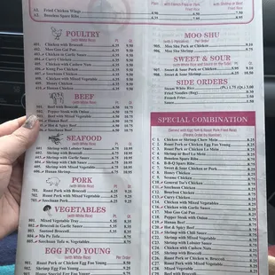 a person holding a menu in a car