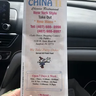 a person holding a ticket in their hand