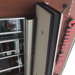 a refrigerator in the corner of a building