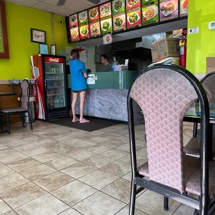 a woman ordering food at a fast food restaurant